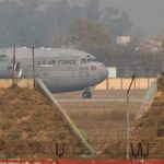 More than 100 Indian migrants deported by the US arrive home